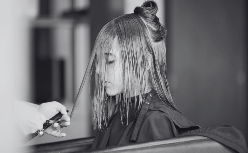 girl getting hair cut 