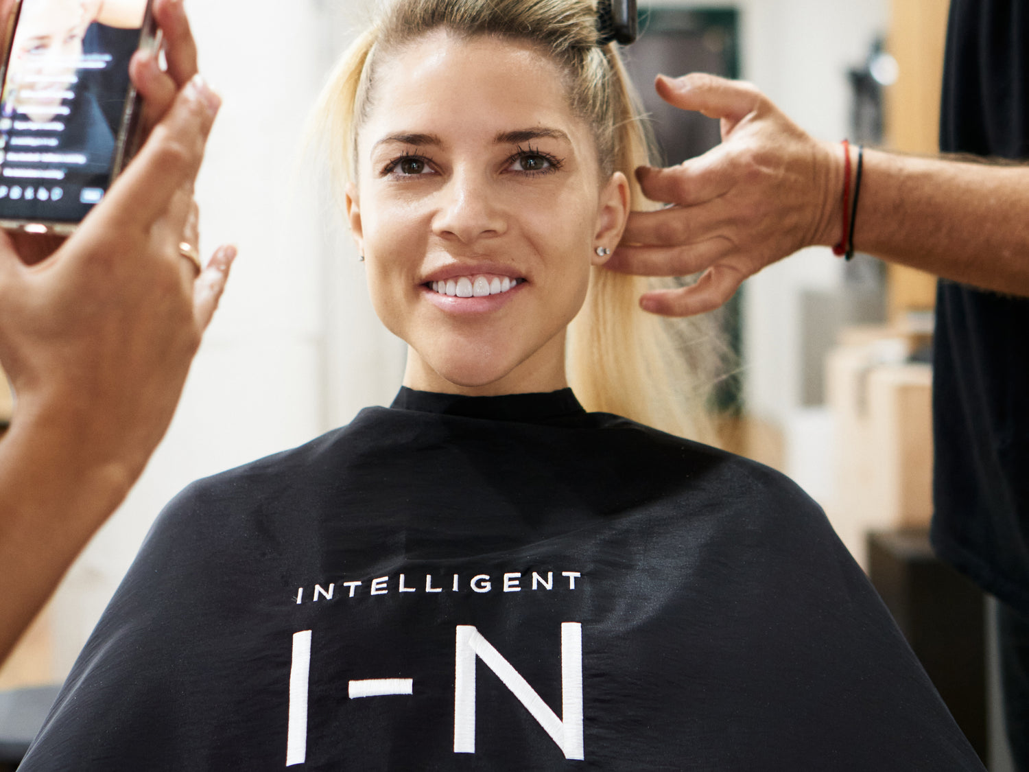 Saral wearing Intelligent I-N gown on set with Hairbrained